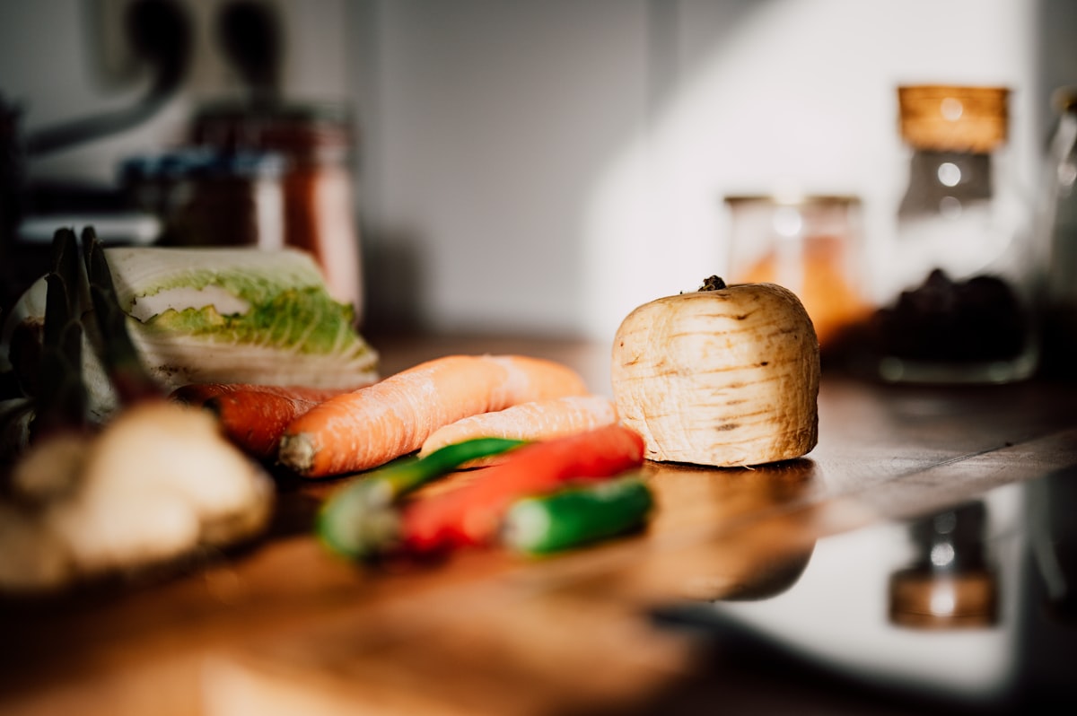 Safe food storage and hygiene practices demonstrated in a modern kitchen